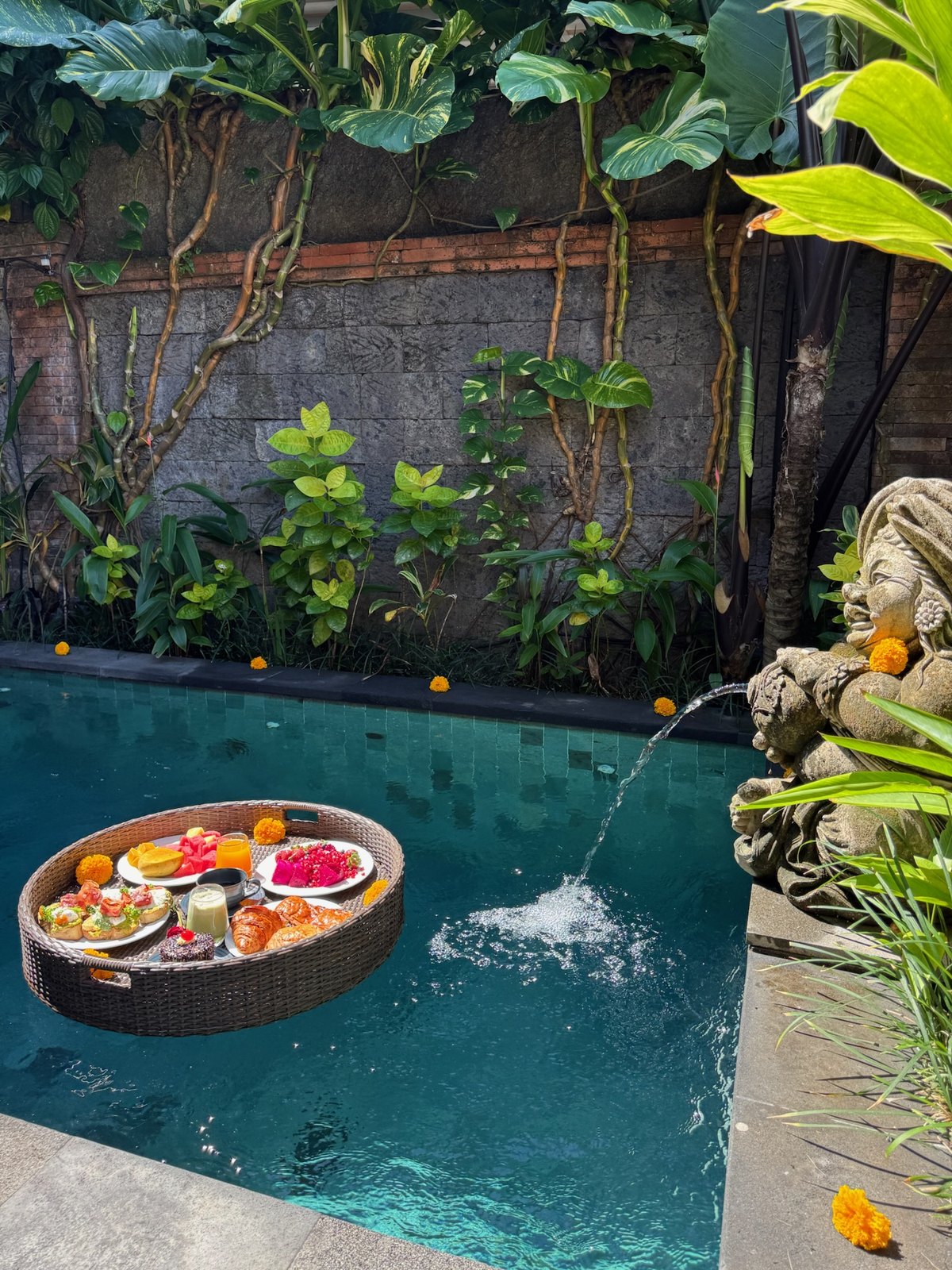Floating breakfast beside the Balinese fountain in the private pool